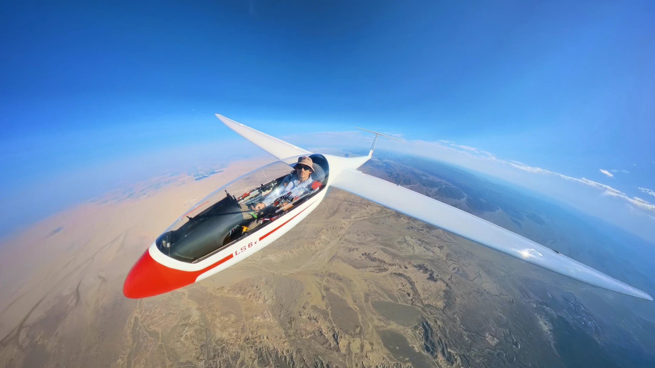 Glider flying above the desert